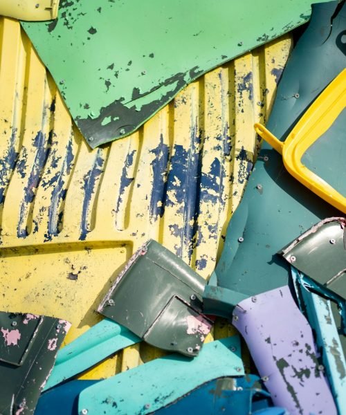 Closeup of multicolored plastic waste pile background