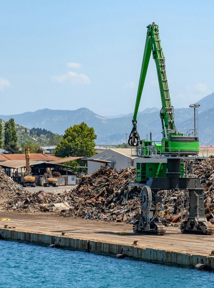 Industrial machinery for loading metal scrap on a sunny dock